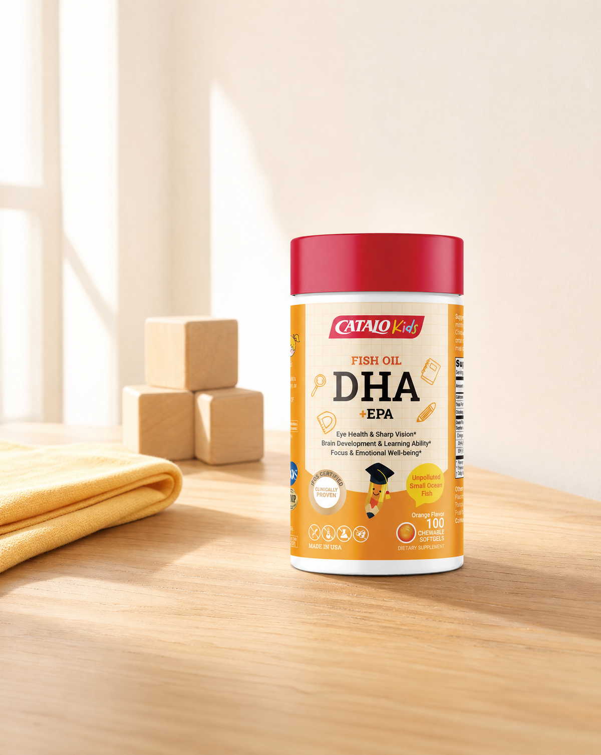 CATALO Kids Fish Oil DHA + EPA chewable softgels on a sunny breakfast table with wooden blocks