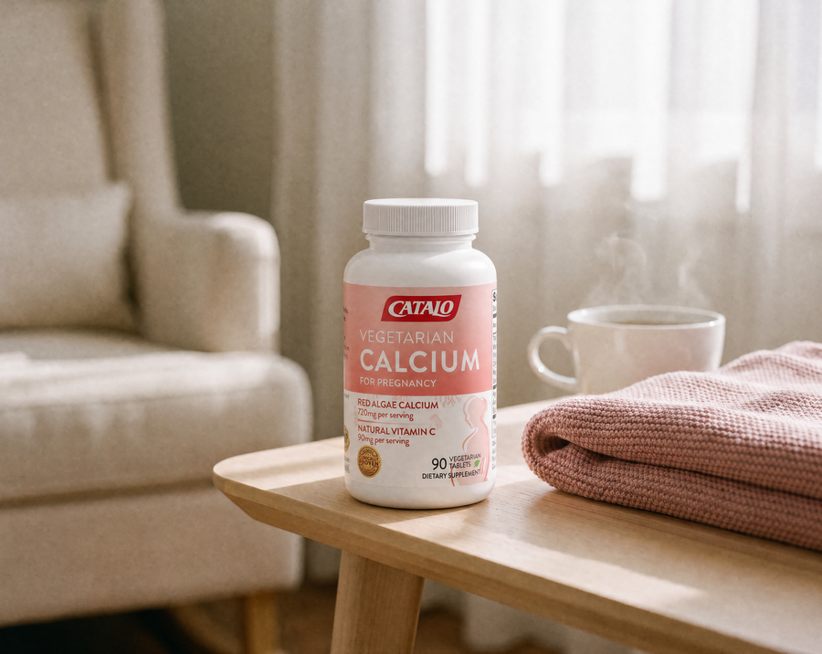 CATALO Vegetarian Calcium for Pregnancy on a side table in a sunlit nursery with a knitted blanket