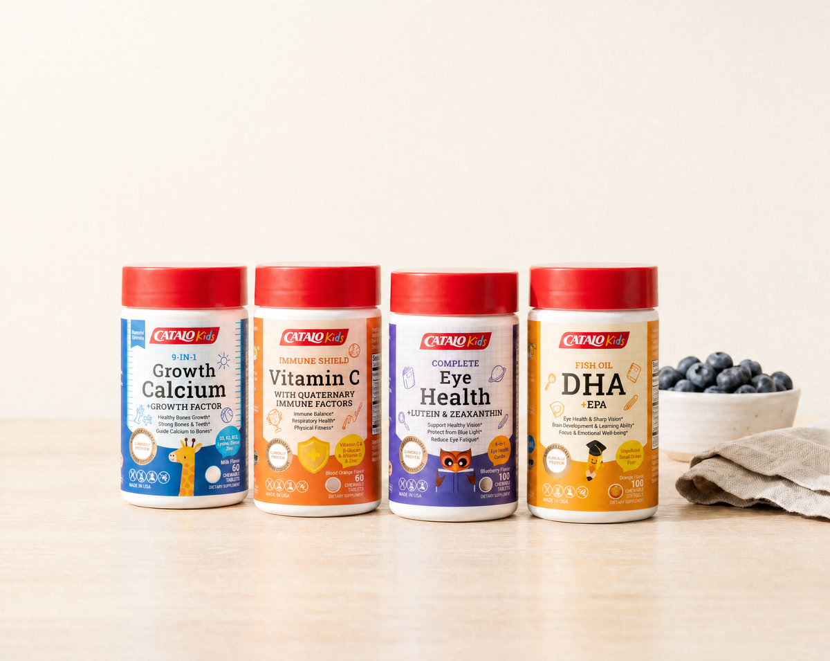 The four CATALO Kids chewables, 9-in-1 Growth Calcium, Immune Shield Vitamin C, Complete Eye Health and Fish Oil DHA, on a sunlit kitchen table